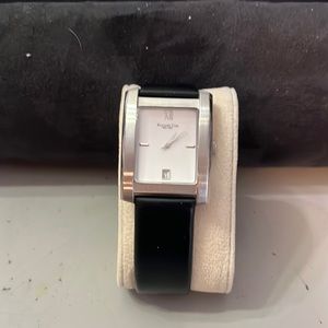 Men watch, battery required. Silver face with black strap